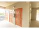 Apartment complex hallway with doors to individual units and an exit at 7005 River Hammock Dr # 204, Bradenton, FL 34212
