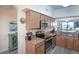 Stylish kitchen with stainless steel appliances and modern finishes at 7005 River Hammock Dr # 204, Bradenton, FL 34212
