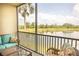 Screened lanai with comfortable seating and a lake view offers a serene outdoor retreat at 7005 River Hammock Dr # 204, Bradenton, FL 34212