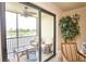 Enjoy serene water views from this screened lanai with comfortable seating and a ceiling fan at 7005 River Hammock Dr # 204, Bradenton, FL 34212