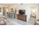 Open-concept living space with stylish decor, wood-look flooring, and comfortable seating at 7005 River Hammock Dr # 204, Bradenton, FL 34212