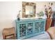 Charming living room with stylish decor and a custom console cabinet at 7005 River Hammock Dr # 204, Bradenton, FL 34212