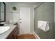 Well-lit bathroom featuring a sleek vanity with granite countertop and a modern glass-enclosed shower at 7202 18Th Nw Ave, Bradenton, FL 34209