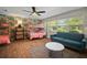 Bedroom with hardwood floors, wallpaper, and window at 7202 18Th Nw Ave, Bradenton, FL 34209