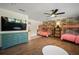 Bedroom with hardwood floors, bunkbeds, wallpaper and green dresser at 7202 18Th Nw Ave, Bradenton, FL 34209