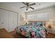 Bedroom features a ceiling fan, matching bedside lamps, and closet space at 7202 18Th Nw Ave, Bradenton, FL 34209
