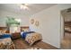 Bedroom featuring twin beds, wooden floors, and a view into the living space at 7202 18Th Nw Ave, Bradenton, FL 34209