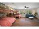 Spacious bedroom with colorful wallpaper, wooden bunk beds, and a sofa at 7202 18Th Nw Ave, Bradenton, FL 34209