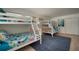 Bunk bedroom featuring bright, nautical themed bedding and large windows at 7202 18Th Nw Ave, Bradenton, FL 34209