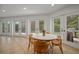 Bright breakfast nook with tile floors, table, and doors leading to the outdoors at 7202 18Th Nw Ave, Bradenton, FL 34209