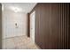 Hallway with wood accent wall, and white trim at 7202 18Th Nw Ave, Bradenton, FL 34209