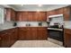 Traditional kitchen with wooden cabinets, stainless steel appliances, and marble backsplash at 7202 18Th Nw Ave, Bradenton, FL 34209