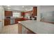 Modern kitchen featuring dark wood cabinets, granite countertops, and stainless steel appliances at 7202 18Th Nw Ave, Bradenton, FL 34209