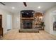 A cozy fireplace framed in rustic stone creates an inviting focal point in this living space at 7202 18Th Nw Ave, Bradenton, FL 34209