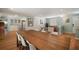 Open layout featuring dining area adjacent to the living room with bright walls and hard floors at 7202 18Th Nw Ave, Bradenton, FL 34209