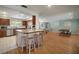 Open floor plan features a kitchen island, dining area, and living room at 7202 18Th Nw Ave, Bradenton, FL 34209