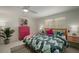 Relaxing main bedroom with a king bed, palm decor, and a ceiling fan at 7202 18Th Nw Ave, Bradenton, FL 34209