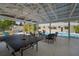 Spacious covered patio with ping pong table and outdoor seating at 7202 18Th Nw Ave, Bradenton, FL 34209