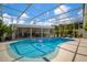 Large screened-in pool with outdoor kitchen and dining area at 7202 18Th Nw Ave, Bradenton, FL 34209