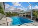 Enclosed pool area with lounge chairs and outdoor dining space at 7202 18Th Nw Ave, Bradenton, FL 34209