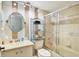 Compact bathroom featuring a shower with sliding door and sink with storage at 7301 29Th Avenue W Dr # 108, Bradenton, FL 34209