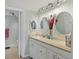 Bright bathroom with vanity, decorative mirrors, and modern fixtures at 7301 29Th Avenue W Dr # 108, Bradenton, FL 34209