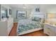 Relaxing bedroom featuring a comfortable bed, dresser, and natural light at 7301 29Th Avenue W Dr # 108, Bradenton, FL 34209