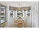 Charming breakfast nook with a sunny window and seating for four at 7301 29Th Avenue W Dr # 108, Bradenton, FL 34209