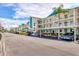 Exterior view of the condo units with parking spots underneath and landscaped grounds at 7301 29Th Avenue W Dr # 108, Bradenton, FL 34209