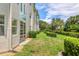 Well-maintained condo building with a lush lawn and manicured hedges in a tranquil, landscaped setting at 7301 29Th Avenue W Dr # 108, Bradenton, FL 34209