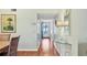 Bright hallway with wood flooring and a view to the front door at 7301 29Th Avenue W Dr # 108, Bradenton, FL 34209