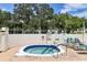 Inviting hot tub with blue tile accents and nearby lounge chairs in a community setting at 7301 29Th Avenue W Dr # 108, Bradenton, FL 34209