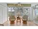 Bright sunroom with tile floors, a ceiling fan, and views of lush greenery at 7301 29Th Avenue W Dr # 108, Bradenton, FL 34209