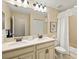 Well-lit bathroom with double sinks, a large mirror, and a bathtub with shower at 7844 52Nd E Ter, Bradenton, FL 34203