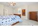 Bright bedroom with a ceiling fan, carpet floors, and a decorative bedspread at 7844 52Nd E Ter, Bradenton, FL 34203