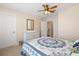Bedroom with a bed, dresser, and blue and white comforter at 7844 52Nd E Ter, Bradenton, FL 34203