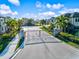 Gated community entrance featuring stately stone pillars and lush landscaping at 7844 52Nd E Ter, Bradenton, FL 34203