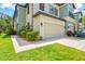 Well-maintained two-story home featuring a two-car garage and lush landscaping at 7844 52Nd E Ter, Bradenton, FL 34203