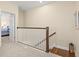 Hallway landing with carpet flooring and decorative railing at 7844 52Nd E Ter, Bradenton, FL 34203