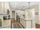 Spacious kitchen with granite countertops, stainless steel appliances, and wooden floors at 7844 52Nd E Ter, Bradenton, FL 34203