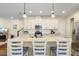 Kitchen with white cabinets, granite counters, stainless appliances, and bar seating at 7844 52Nd E Ter, Bradenton, FL 34203