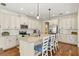Bright kitchen with stainless steel appliances, a large island, and hardwood floors at 7844 52Nd E Ter, Bradenton, FL 34203