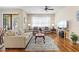Bright living room with hardwood floors, comfortable seating, and an open layout at 7844 52Nd E Ter, Bradenton, FL 34203