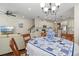 Open concept living space with dining area, kitchen, and staircase at 7844 52Nd E Ter, Bradenton, FL 34203