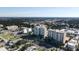 Scenic aerial view showcasing the luxury high-rise buildings surrounded by lush landscaping at 800 N Tamiami Trl # 604, Sarasota, FL 34236