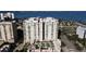 Stunning aerial view showcasing the luxury high-rise buildings with balconies and waterfront access at 800 N Tamiami Trl # 604, Sarasota, FL 34236