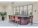 Chic bar area with dark wood counter and comfortable bar stools, ideal for entertaining guests at 800 N Tamiami Trl # 604, Sarasota, FL 34236