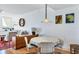 Cozy dining area adjacent to the living room, featuring a round table, seating, and stylish decor, creating an inviting atmosphere at 800 N Tamiami Trl # 604, Sarasota, FL 34236