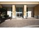 Welcoming entryway with stately columns and well-maintained brick pavement at 800 N Tamiami Trl # 604, Sarasota, FL 34236