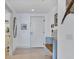 Cozy foyer with decorative accents, a bench, and tiled flooring at 800 N Tamiami Trl # 604, Sarasota, FL 34236